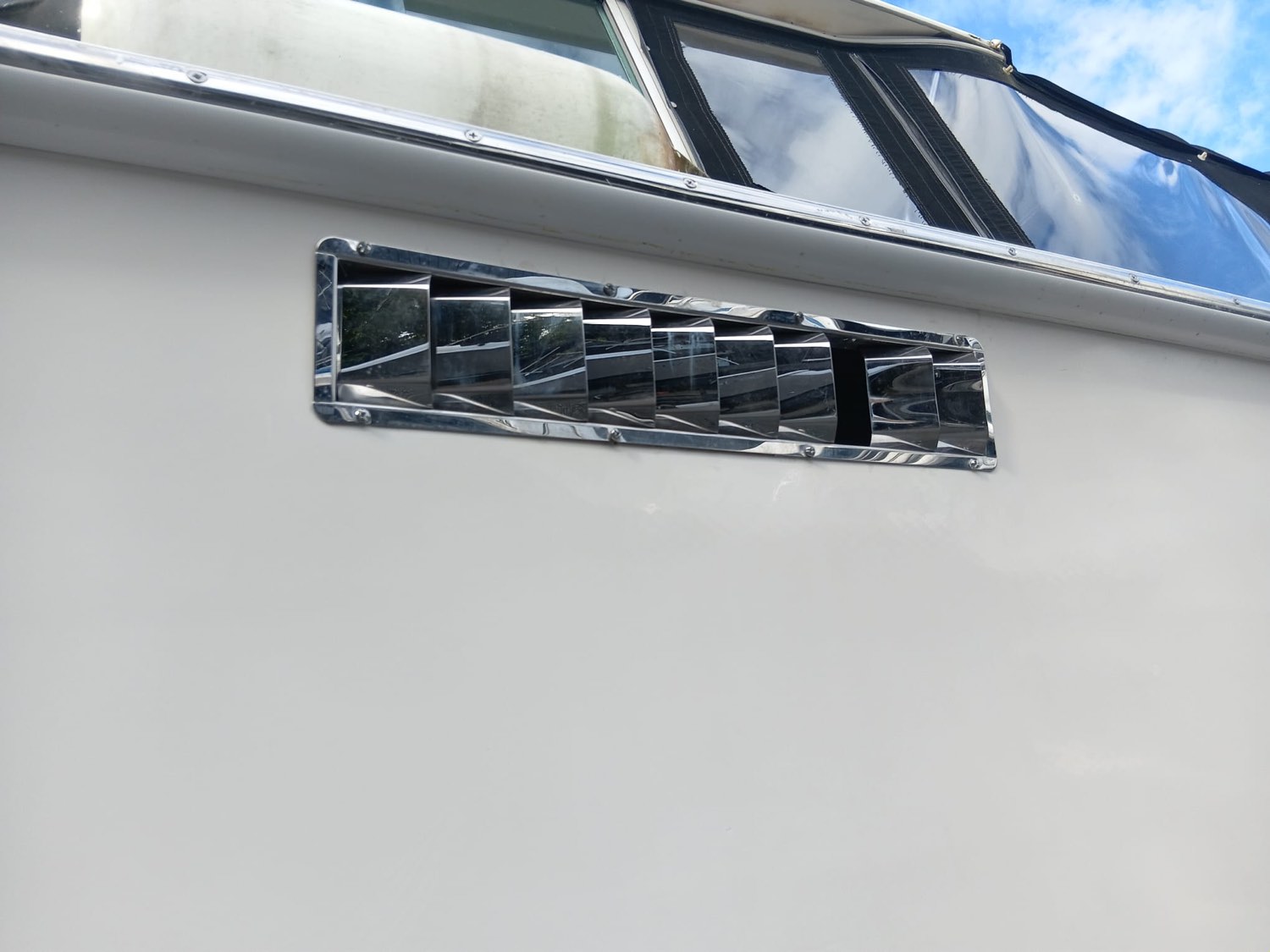 Restored stainless hull vent polished to a mirror finish